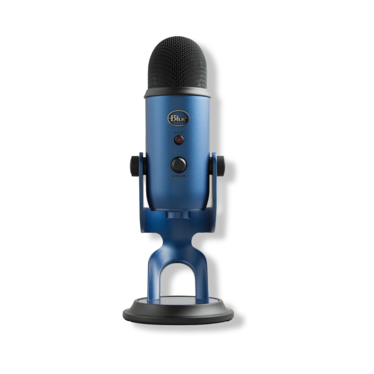 Blue Yeti premium USB microphone on desktop beside laptop, ideal for podcasting and streaming