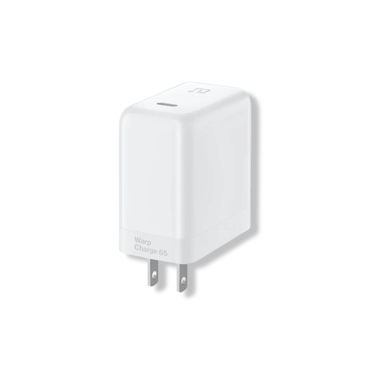 OnePlus Warp Charge 65W adapter on desk charging a OnePlus smartphone